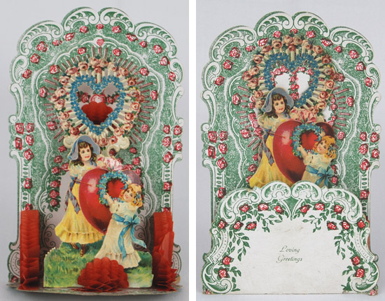 Grußkarten zum Valentinstag: zwei Mädchen schmücken ein großes Herz mit Blumen.